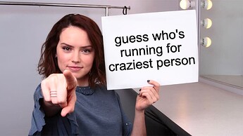 Daisy Ridley pointing at user holding sign reading 'guess who's running for craziest person'